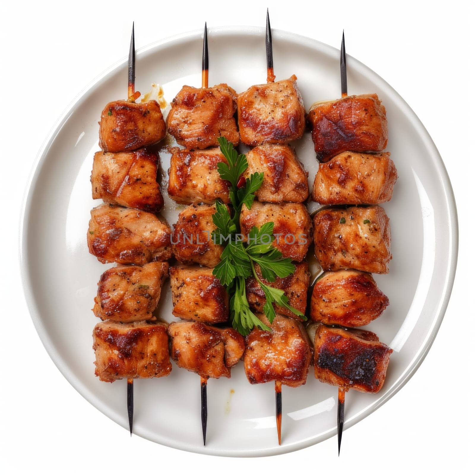 Top view of marinated and grilled chicken meat skewers isolated on white background.