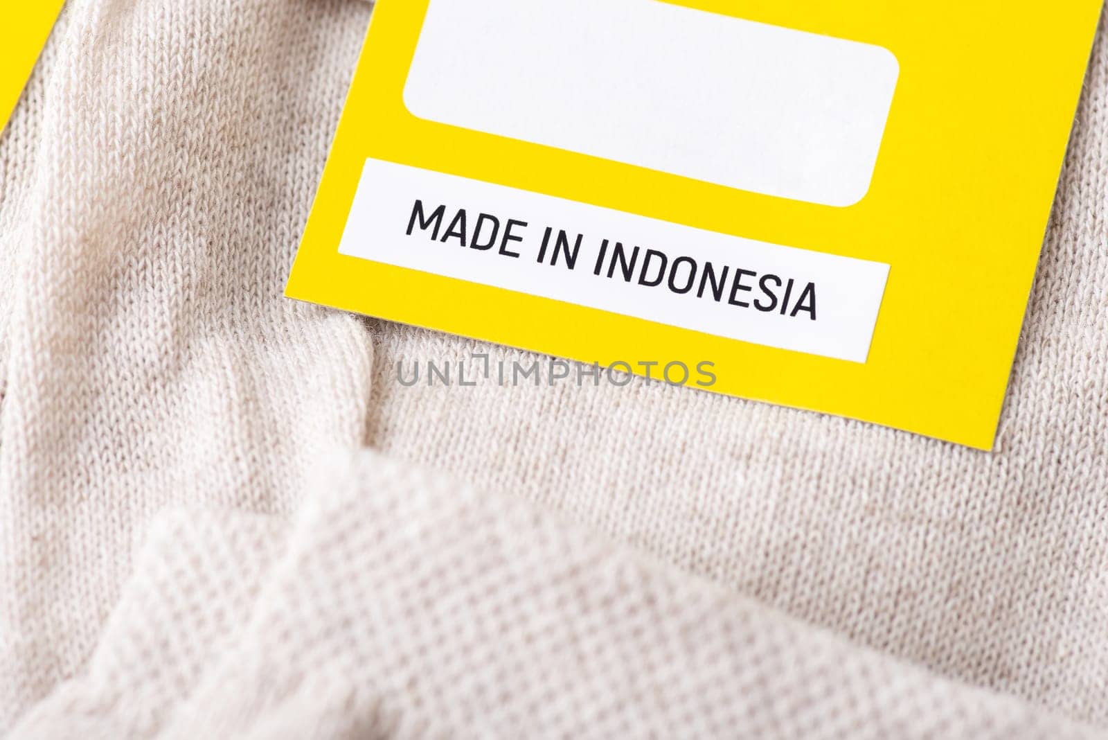 Made in Indonesia inscription on label of socks by VitaliiPetrushenko