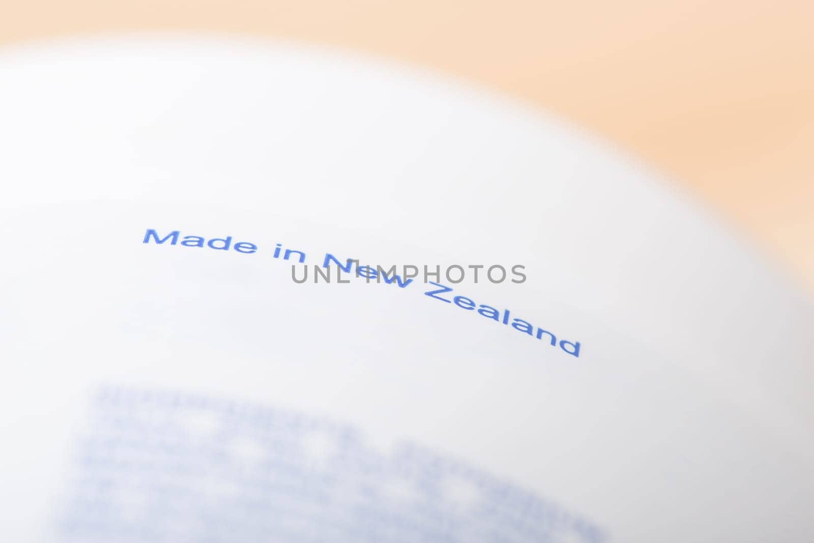 Made in New Zealand inscription on white box of cream by VitaliiPetrushenko