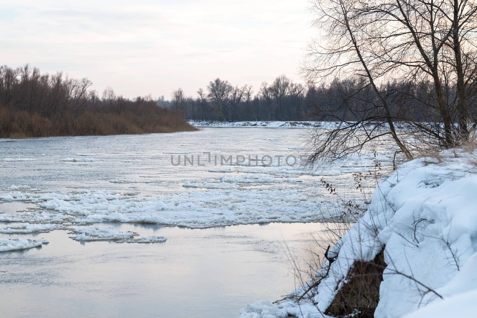 River in winter, ice on the water surface