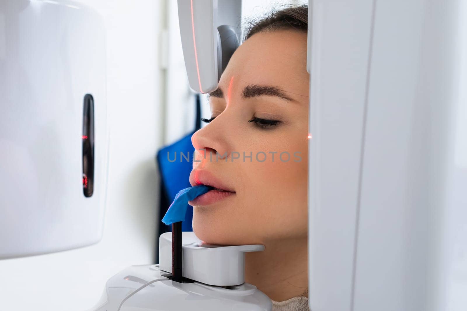 Young Woman Receiving Panoramic X ray for Teeth Examination by vladimka