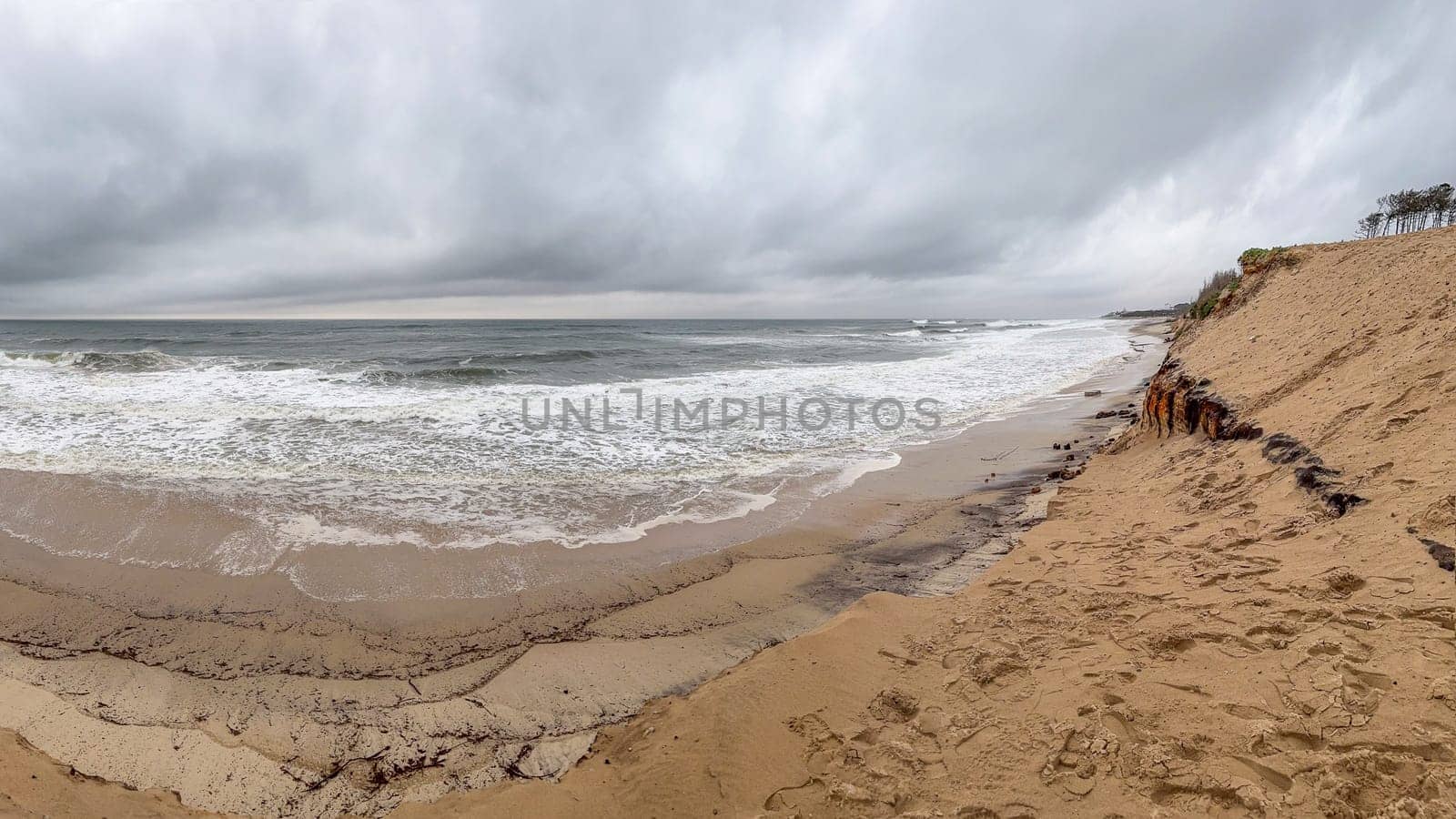 Ovar, Portugal - February 11, 2024: Storm Karlota worsens the fragile dune protection on Maceda's beach.