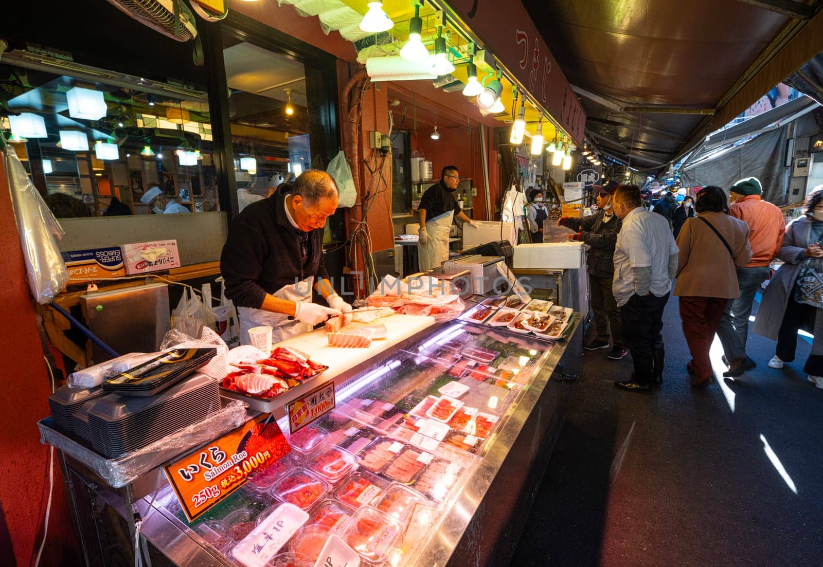 Tokyio, Japan. January 9, 2024. preparing food at stalls at the Tsukiji Outer Market in the city centre