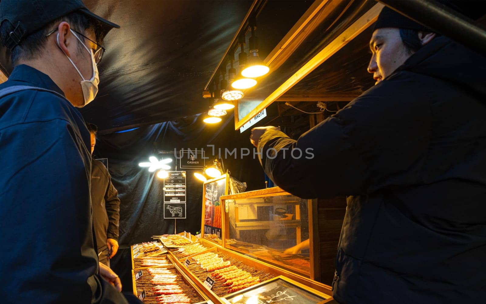 Tokyio, Japan. January 9, 2024. preparing food at stalls at the Tsukiji Outer Market in the city centre