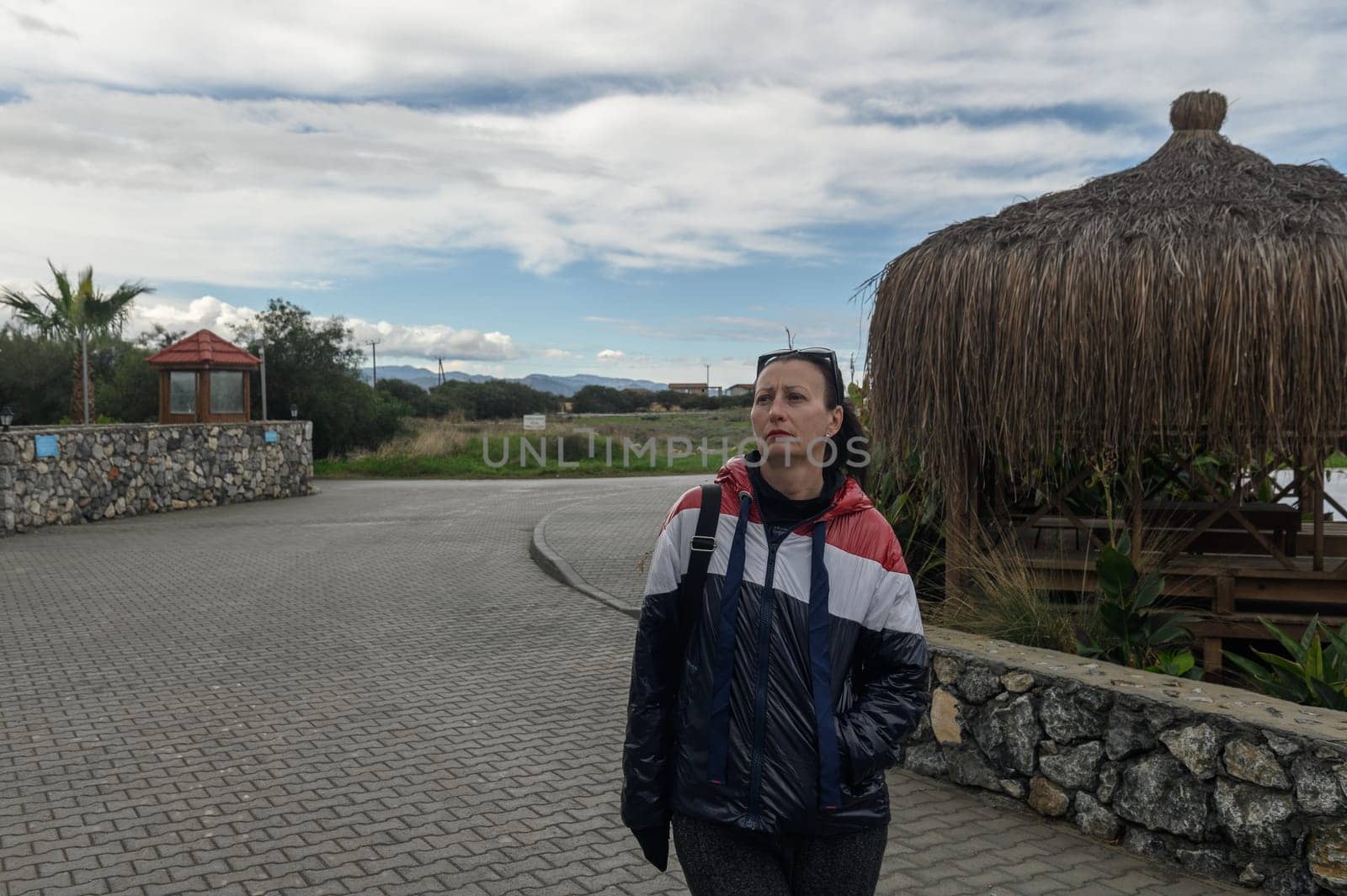 portrait of a woman in a red blue and white jacket in Cyprus 2