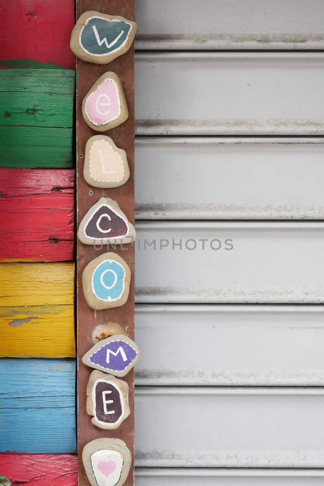 welcome hand written text on hanging on cafe door by towfiq007