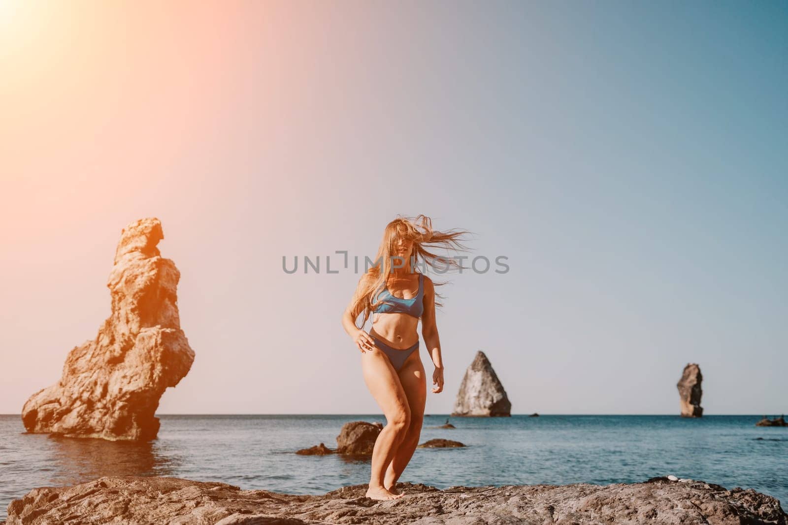 Woman sea pilates. Sporty happy middle aged woman practicing fitness on beach near sea, smiling active female training on yoga mat outside, enjoying healthy lifestyle, harmony and meditation. by panophotograph