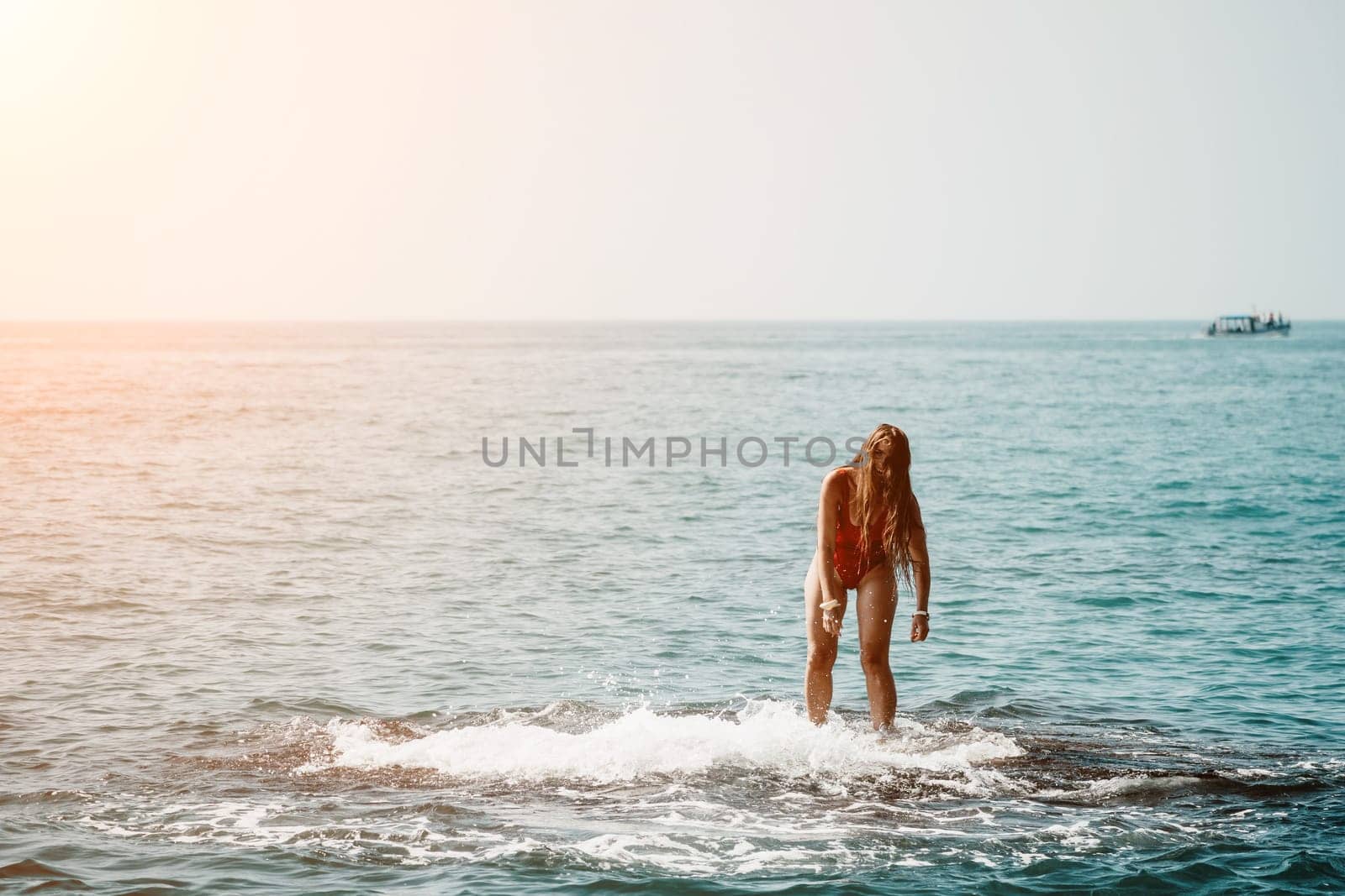 Woman sea yoga. Happy woman meditating in yoga pose on the beach, ocean and rock mountains. Motivation and inspirational fit and exercising. Healthy lifestyle outdoors in nature, fitness concept. by panophotograph