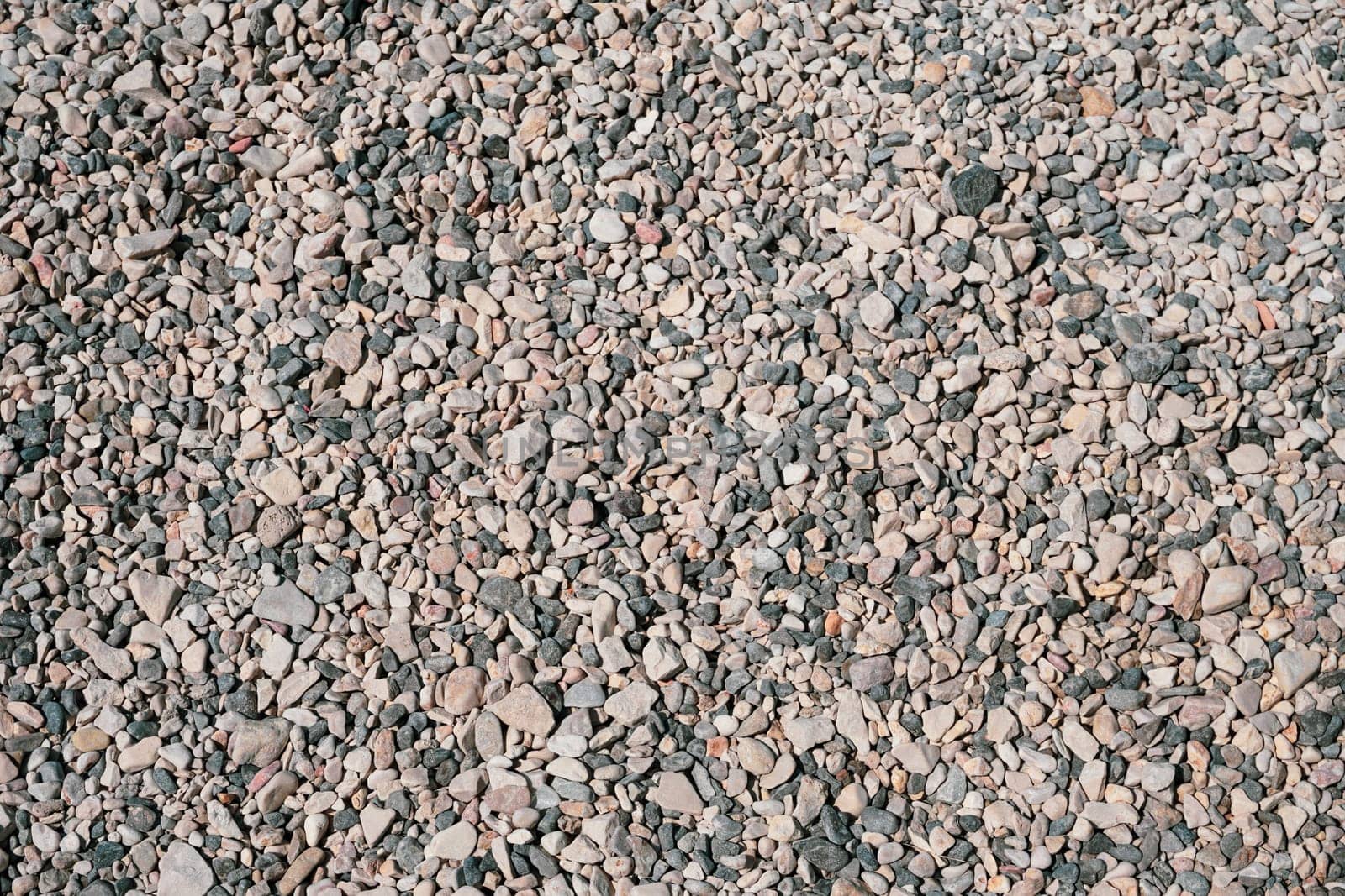 Fine pebbles on the beach on a sunny day