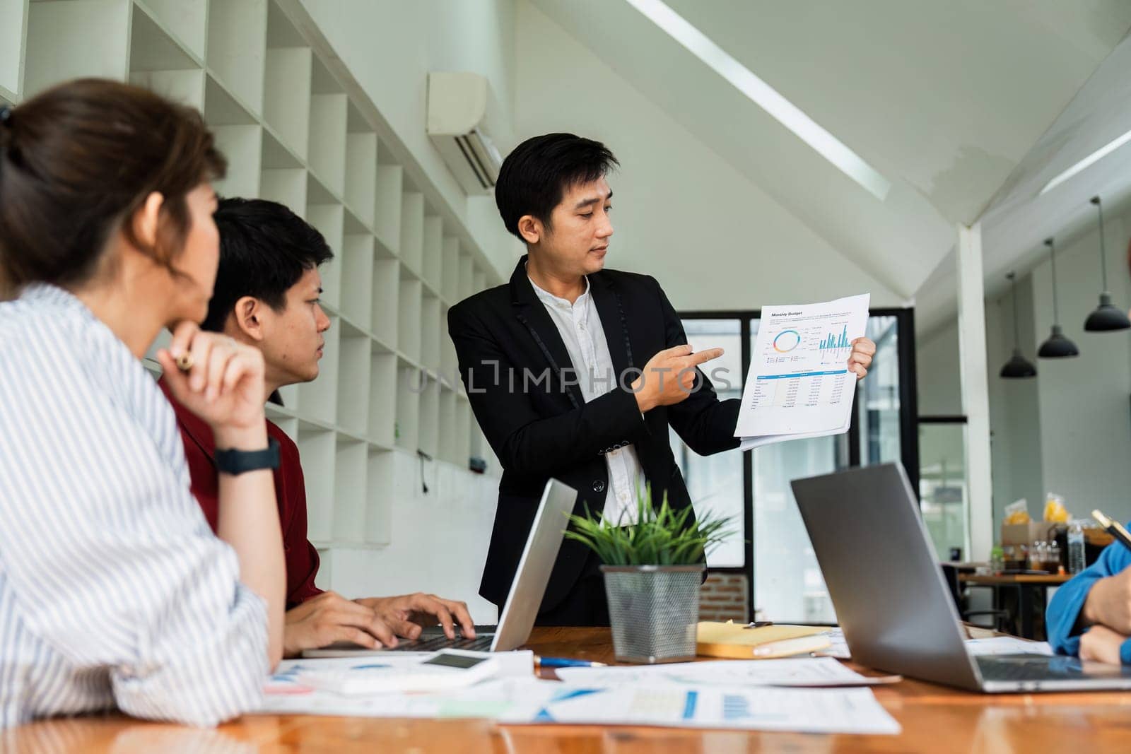 Business team colleagues meeting to conference professional investor working a new marketing business strategy project discussion and analysis data chart and graph.