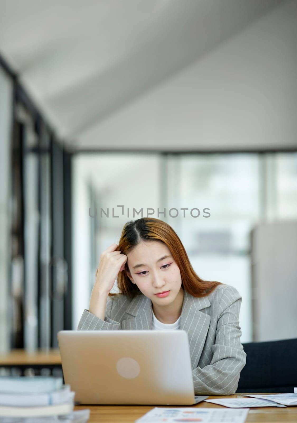 Female employees are stressed and tired. Headache from thinking and pressure from work by ijeab