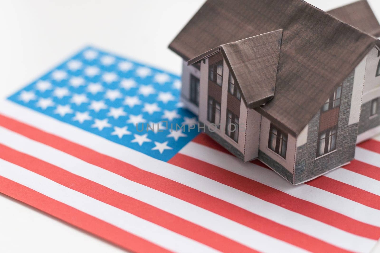 Real Estate Concept. Living House over American Flag extreme closeup. 3d Rendering. High quality photo