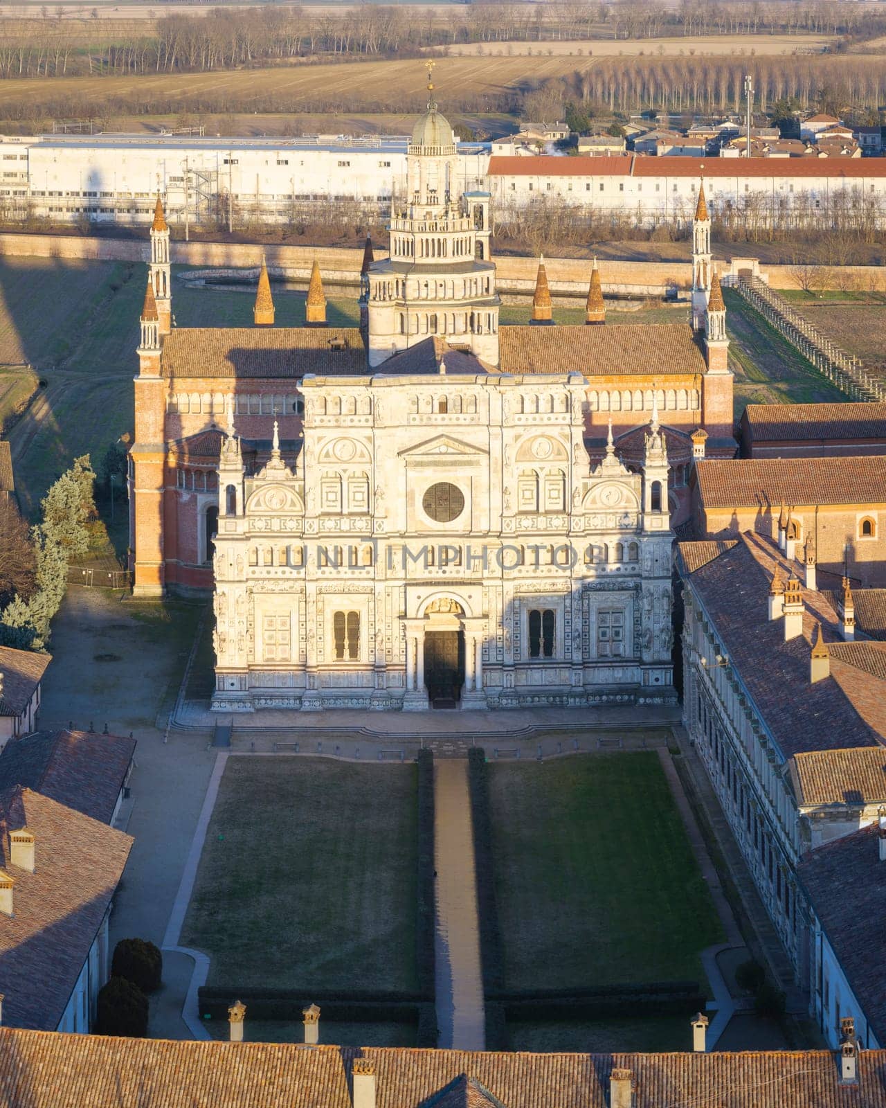 Aerial shot of Certosa di Pavia cathedral a historical monumental complex that includes a monastery and a sanctuary. Pavia ,Italy.