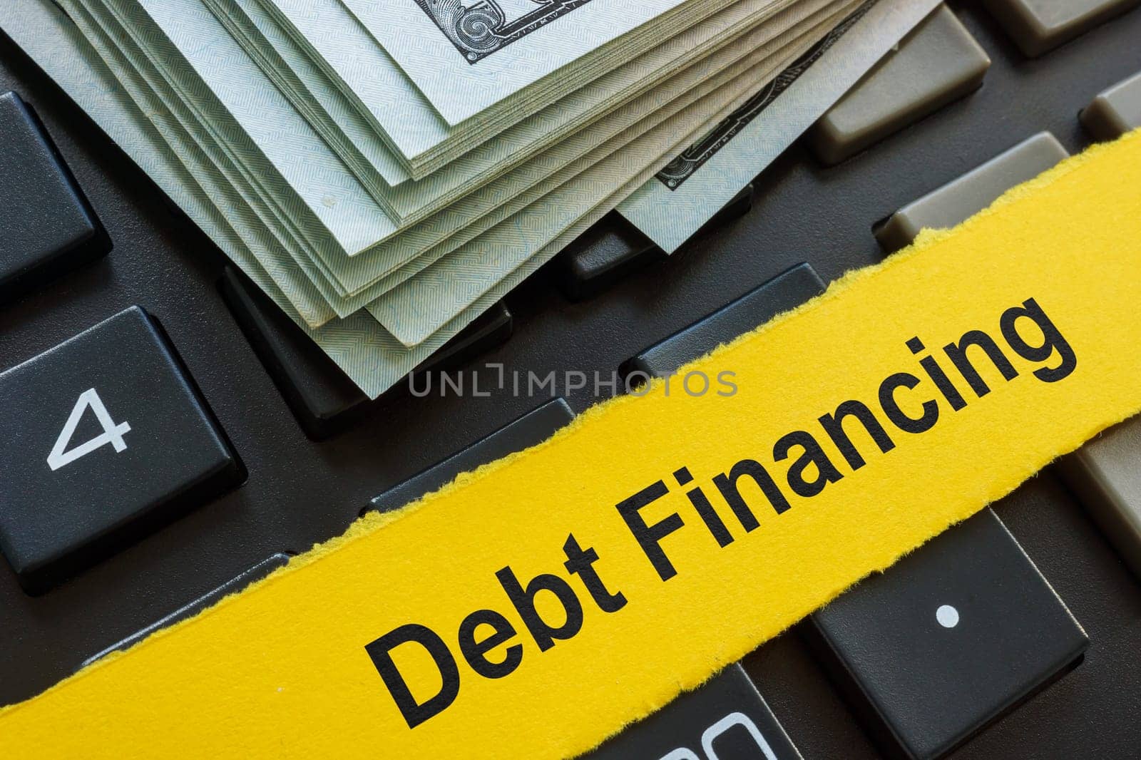 Cash, calculator and inscription Debt financing.