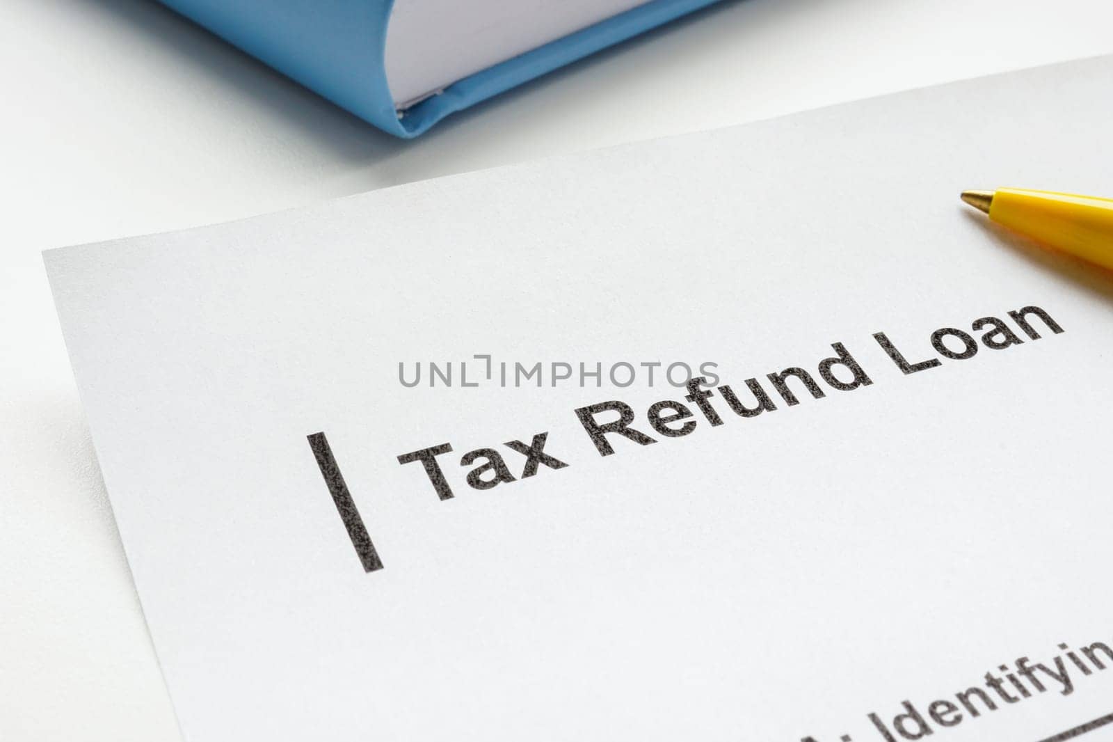 Tax refund loan application and pen. by designer491