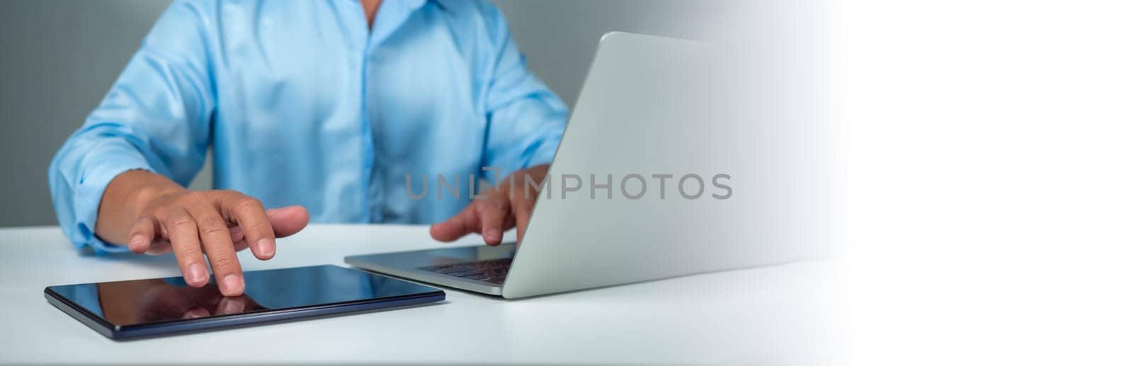 Businessman using tablet to login represents protection concept of cyber security and data security including secure login. by Unimages2527