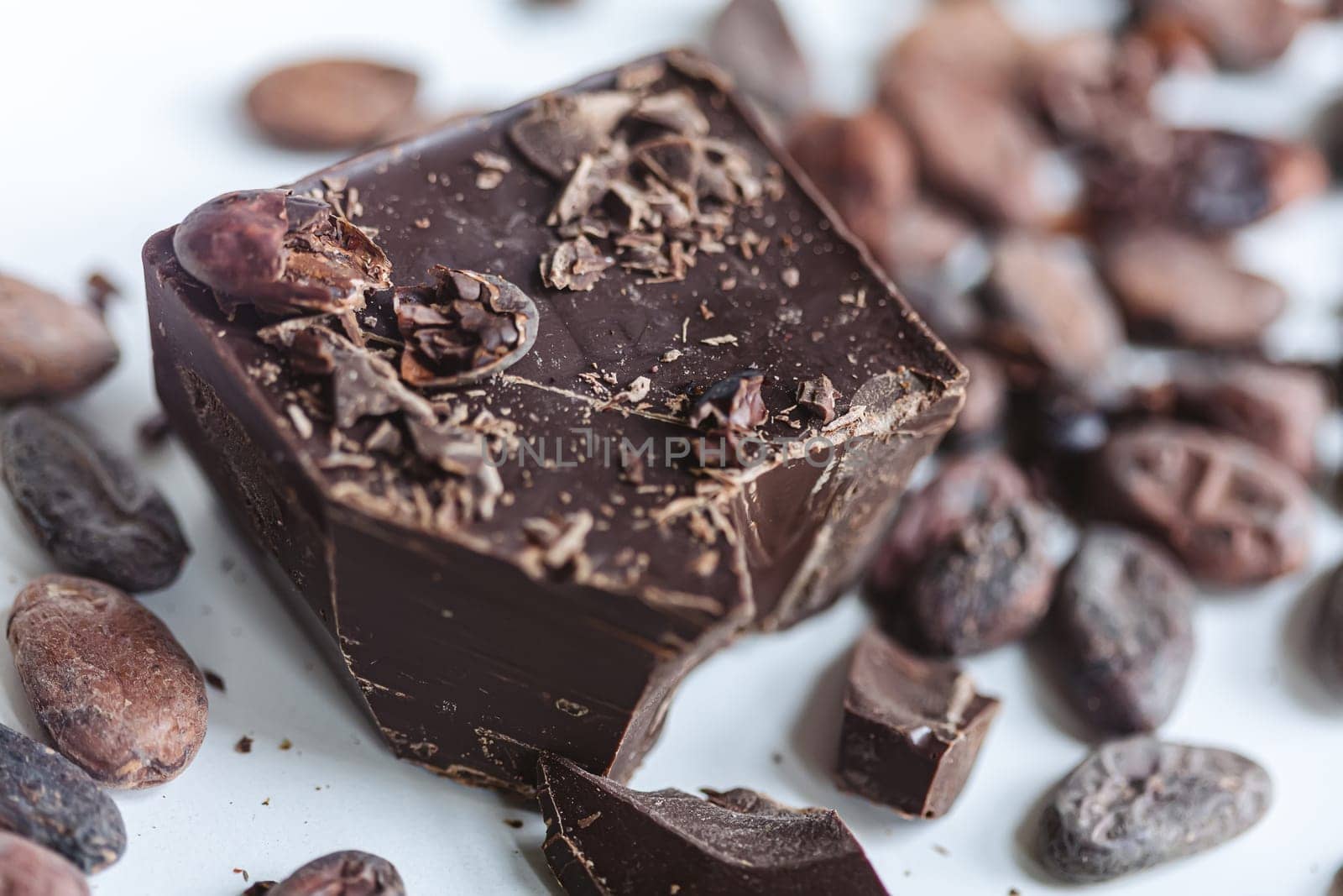 Cocoa beans with chocolate on a white background. Shalllow dof. by sarymsakov