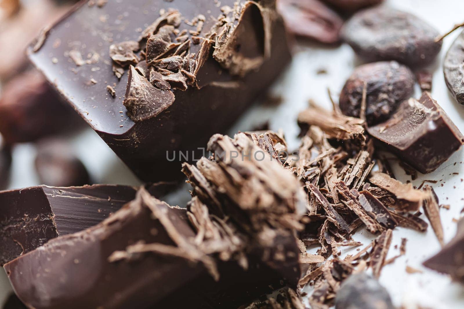 Cocoa beans with chocolate on a white background. Shalllow dof. by sarymsakov