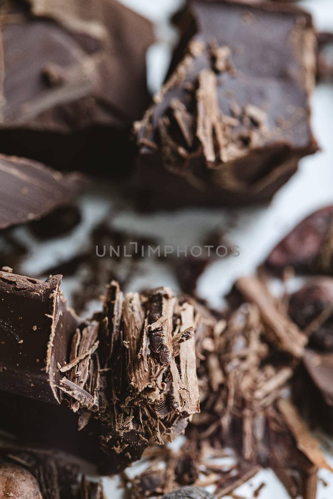Cocoa beans with chocolate on a white background. Shalllow dof. by sarymsakov