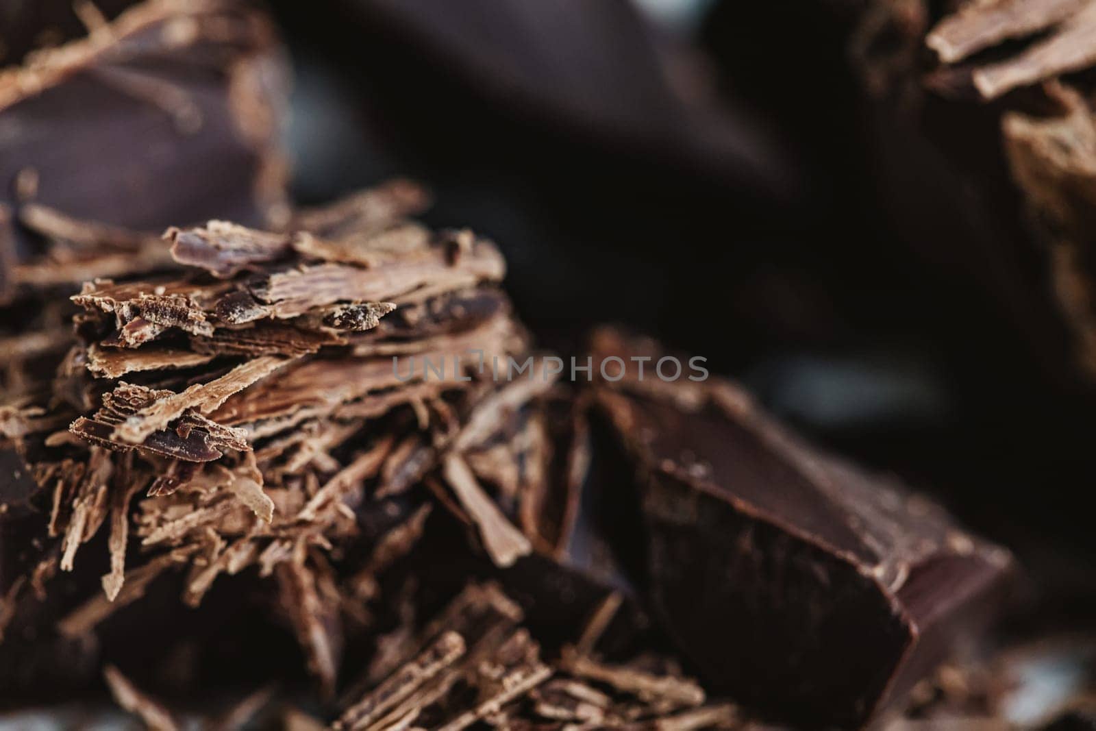 Cocoa beans with chocolate on a white background. Shalllow dof. Top view