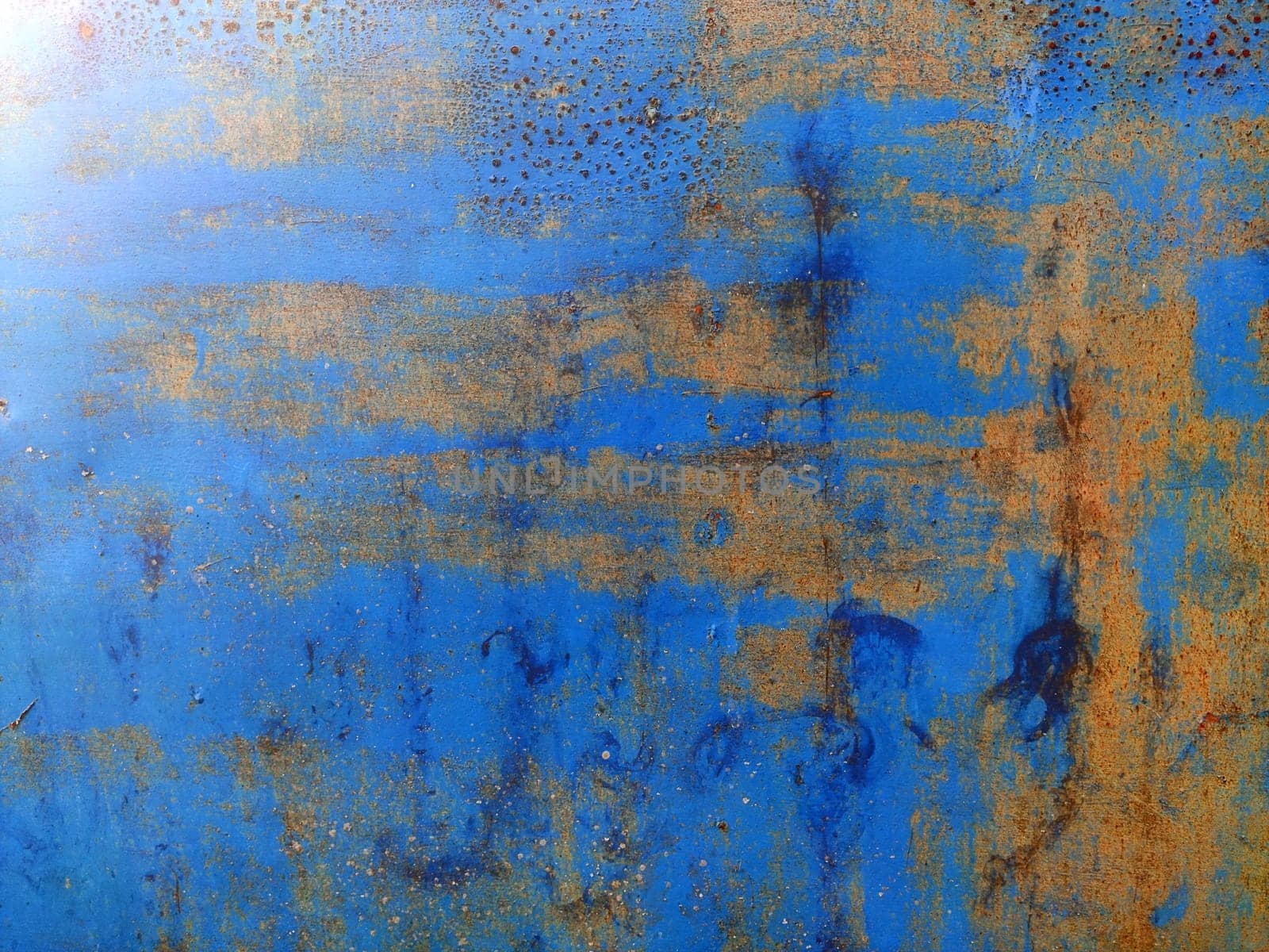 Marks and rust patterns on metal containers. Rusty corrosion and oxidized background. Worn metallic iron rusty metal background by OnPhotoUa