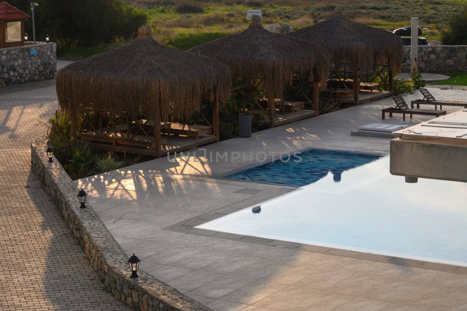 reed bungalow near the pool in a residential complex