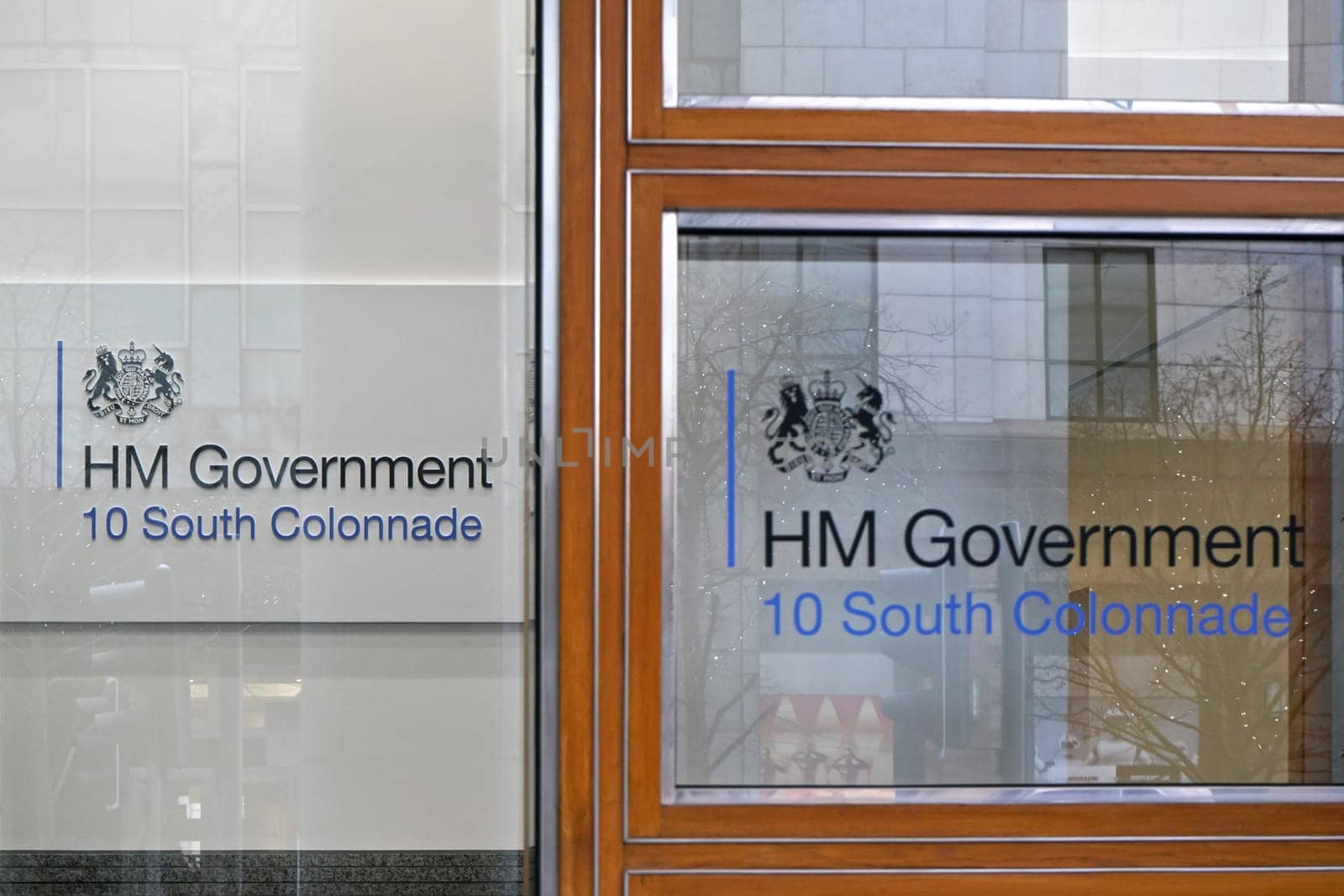 London, United Kingdom - February 03, 2019: HM Government sign at their offices on 10 South Colonnade. Her Majesty's Government, is the central administration of the United Kingdom by Ivanko