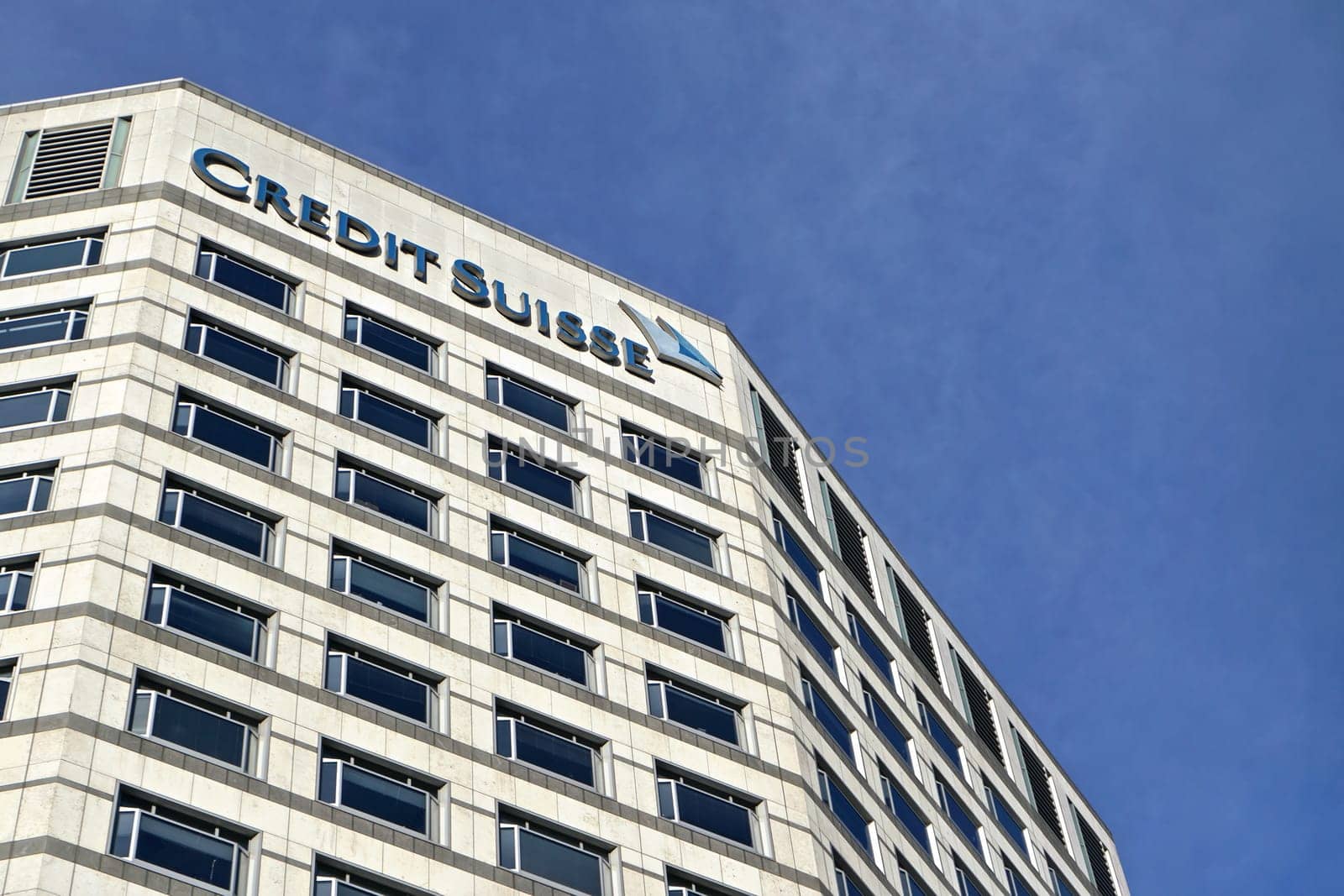 London, United Kingdom - February 03, 2019: Modern offices of UK branch of Credit Suisse at Canary Wharf. CS Group AG is multinational investment bank founded in 1856 by Ivanko