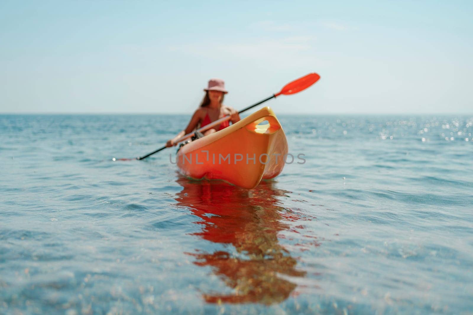 Kayak sea woman. Happy attractive woman with long hair in red swimsuit, swimming on kayak. Summer holiday vacation and travel concept. by Matiunina