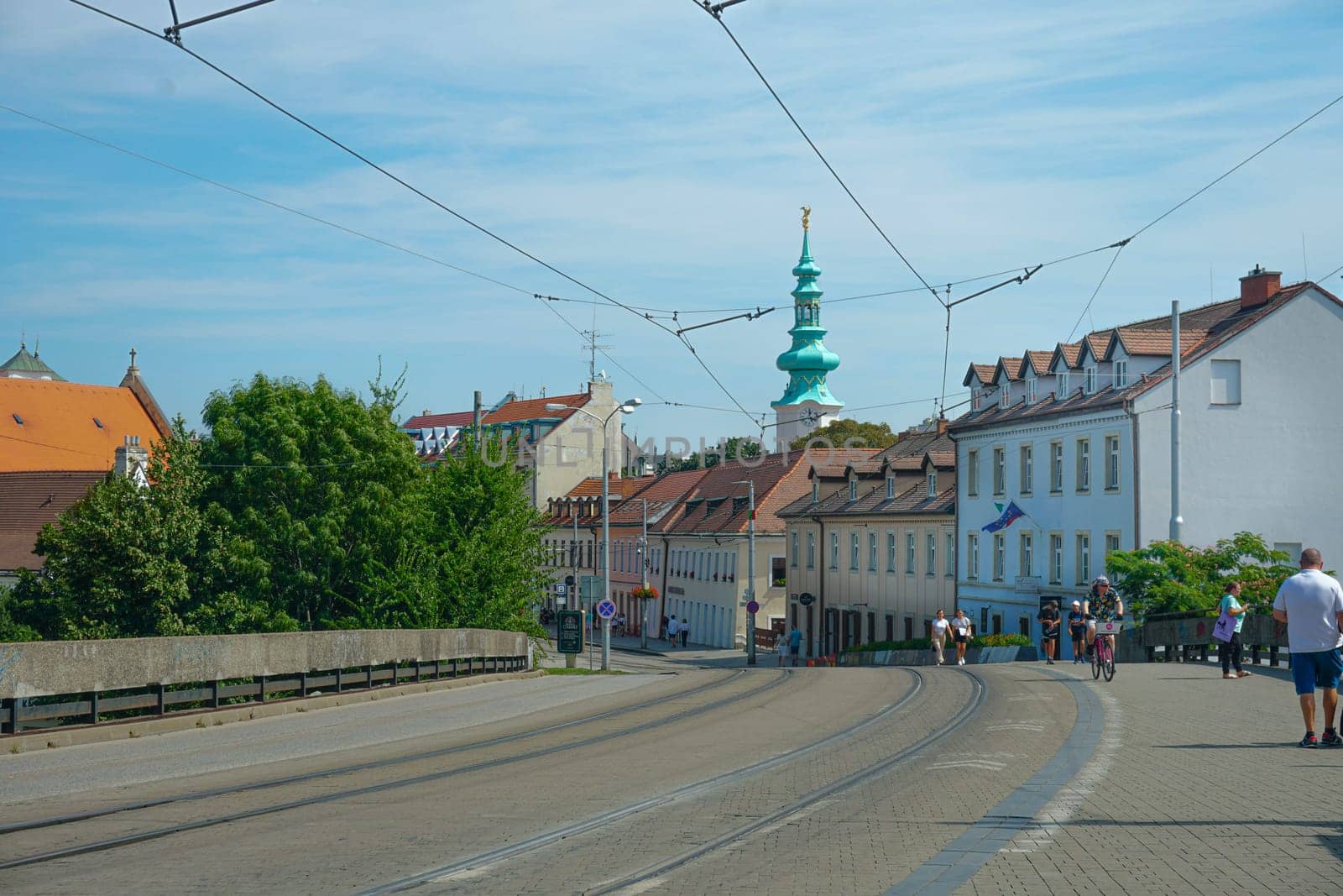 Bratislava, Slovakia, August 25, 2023: People on Kapucinska street in the old town on a sunny summer day