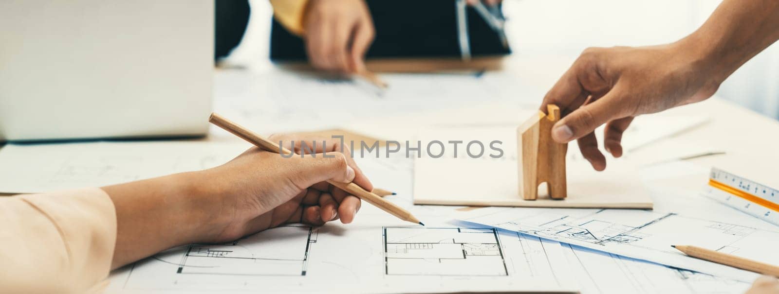 Professional architect hand draw a blueprint on table. Closeup. Delineation. by biancoblue