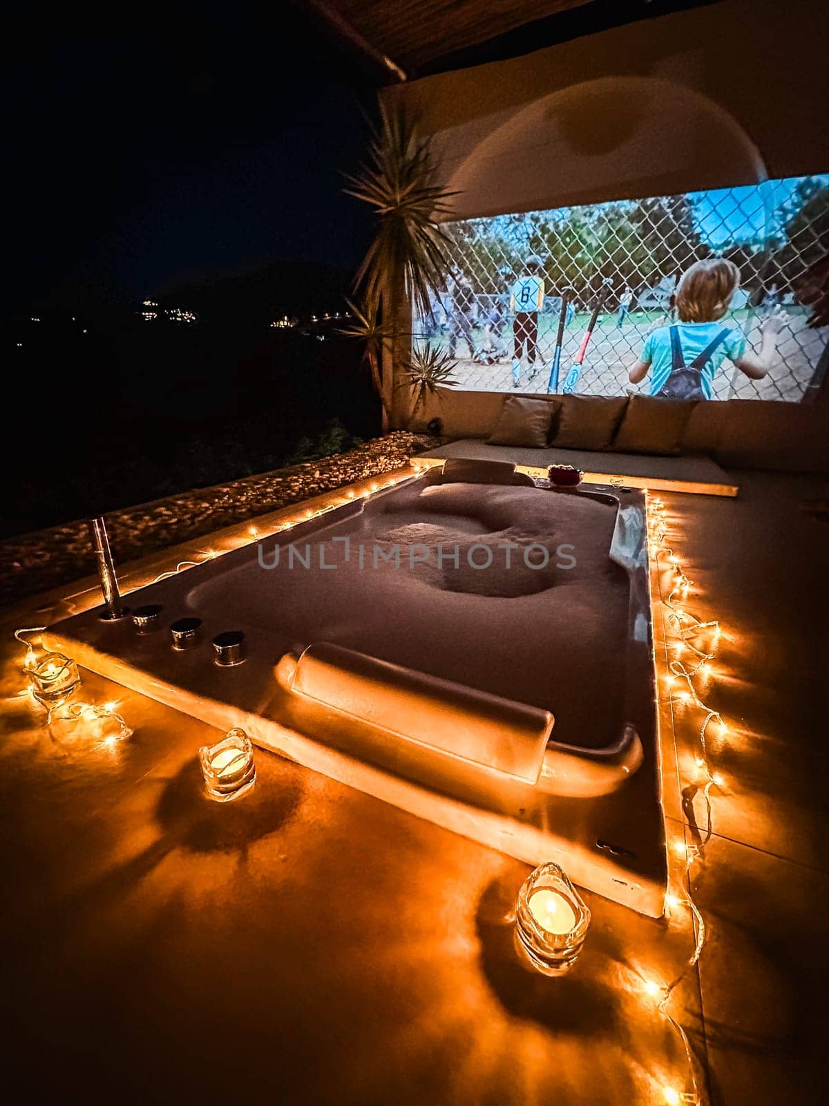 Night jacuzzi bathtub with movie projection in Doi Chang in Chiang Rai, Thailand by worldpitou