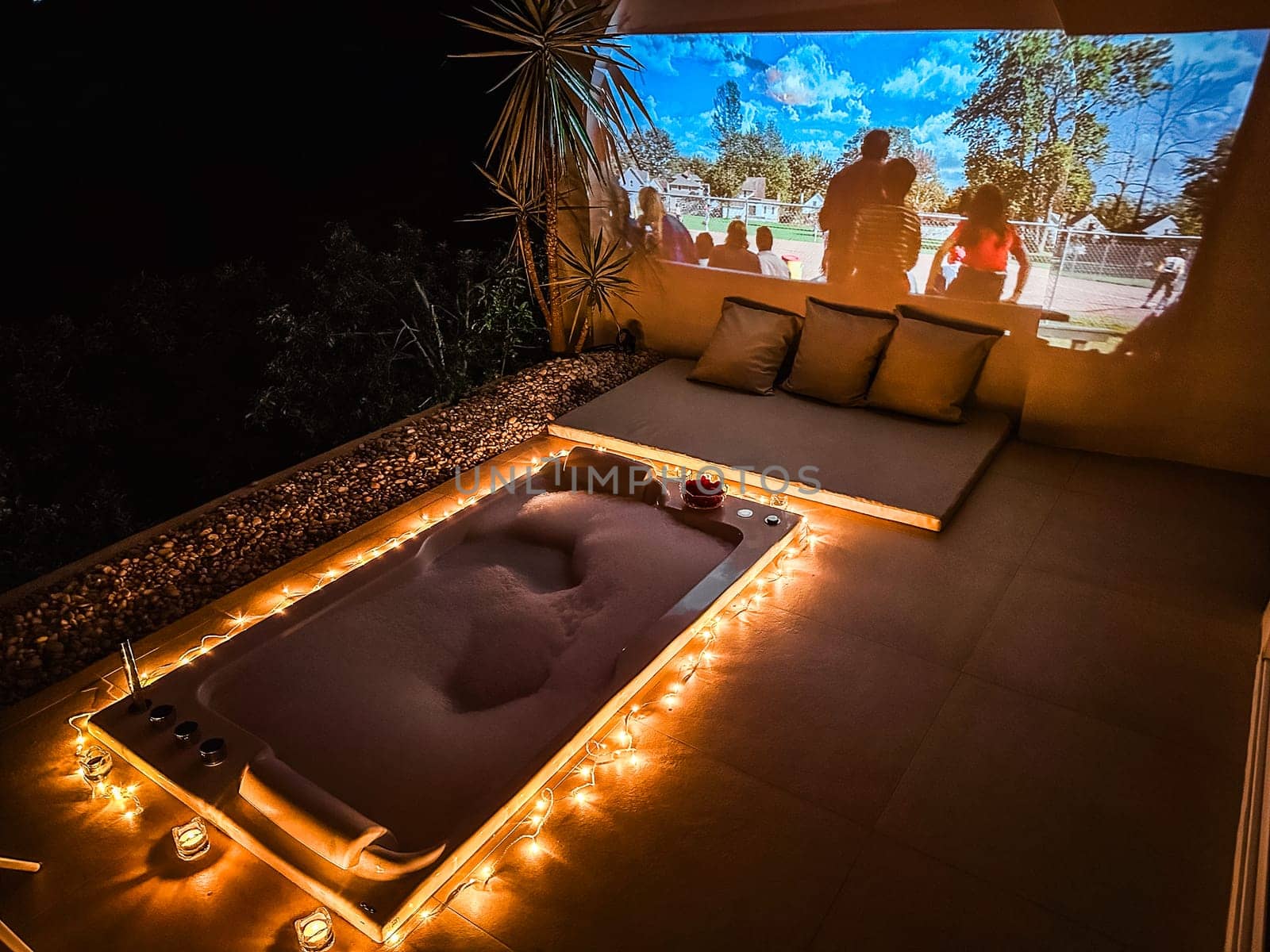 Night jacuzzi bathtub with movie projection in Doi Chang in Chiang Rai, Thailand by worldpitou