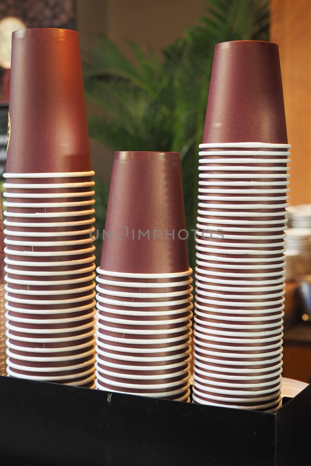 Lots of paper coffee cups at cafe ,