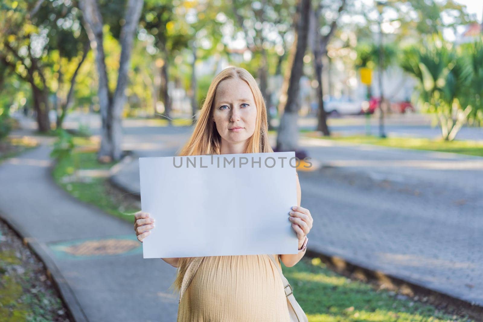 pregnant woman takes a stand for the rights of pregnant women, engaging in a solo picket to advocate for awareness, support, and the empowerment of expectant mothers by galitskaya