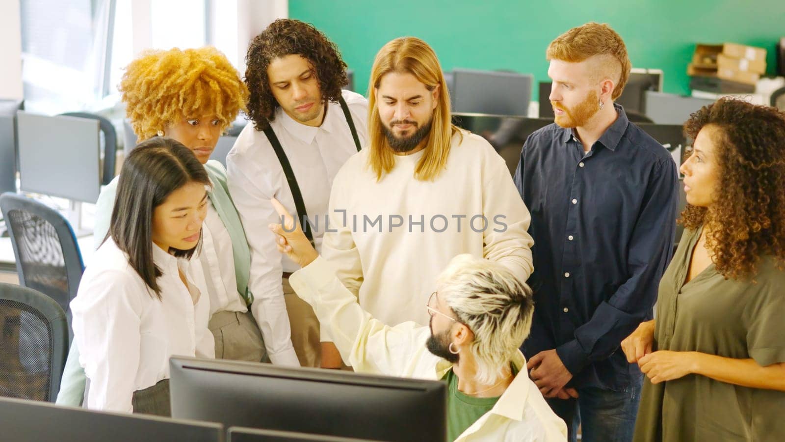 Modern man scolding colleagues seriously in a coworking space