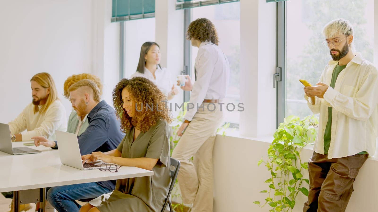 Photo of diverse people working in a modern coworking space