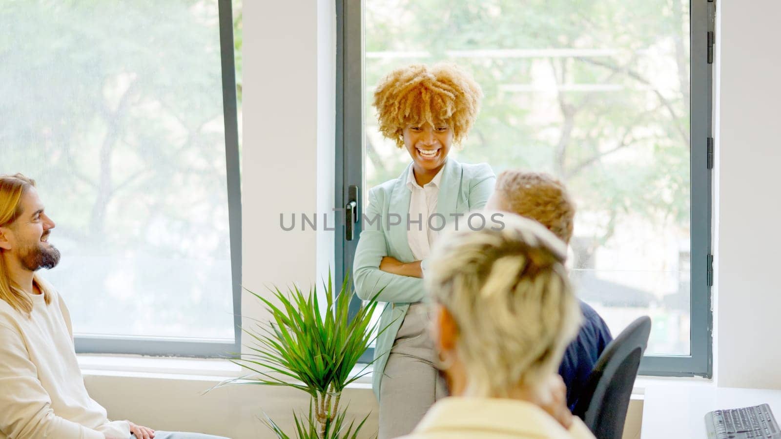 African businesswoman smiling in a meeting by ivanmoreno