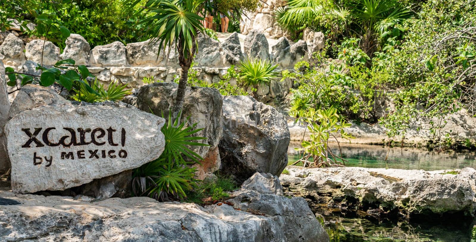 Cancun, Mexico - September 13, 2021: Xcaret theme park sign on big stone in Mexico by Mariakray