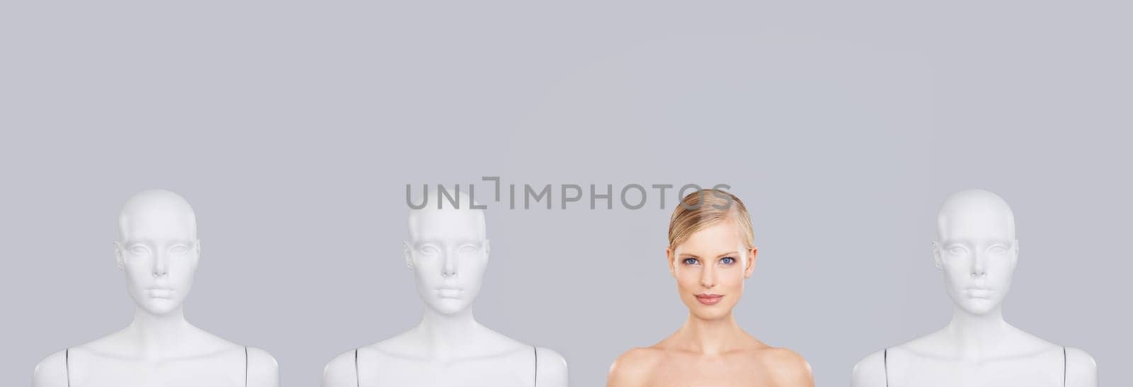 Woman, face and beauty with mannequin and unique for skincare, wellness and portrait on white background. Banner, natural cosmetics and dermatology with individuality, robot or dummy in studio.
