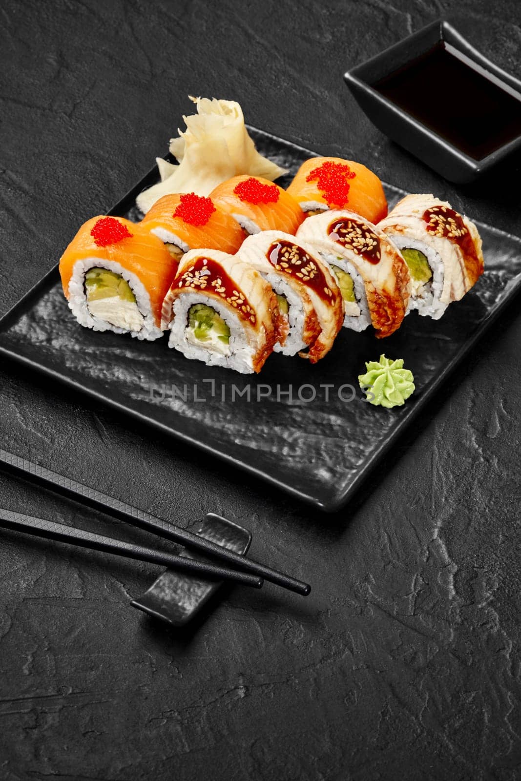 Classic Philadelphia rolls topped with salmon, tobiko, eel and sesame drizzled with unagi sauce traditionally served with wasabi, pickled ginger and soy sauce. Japanese cuisine