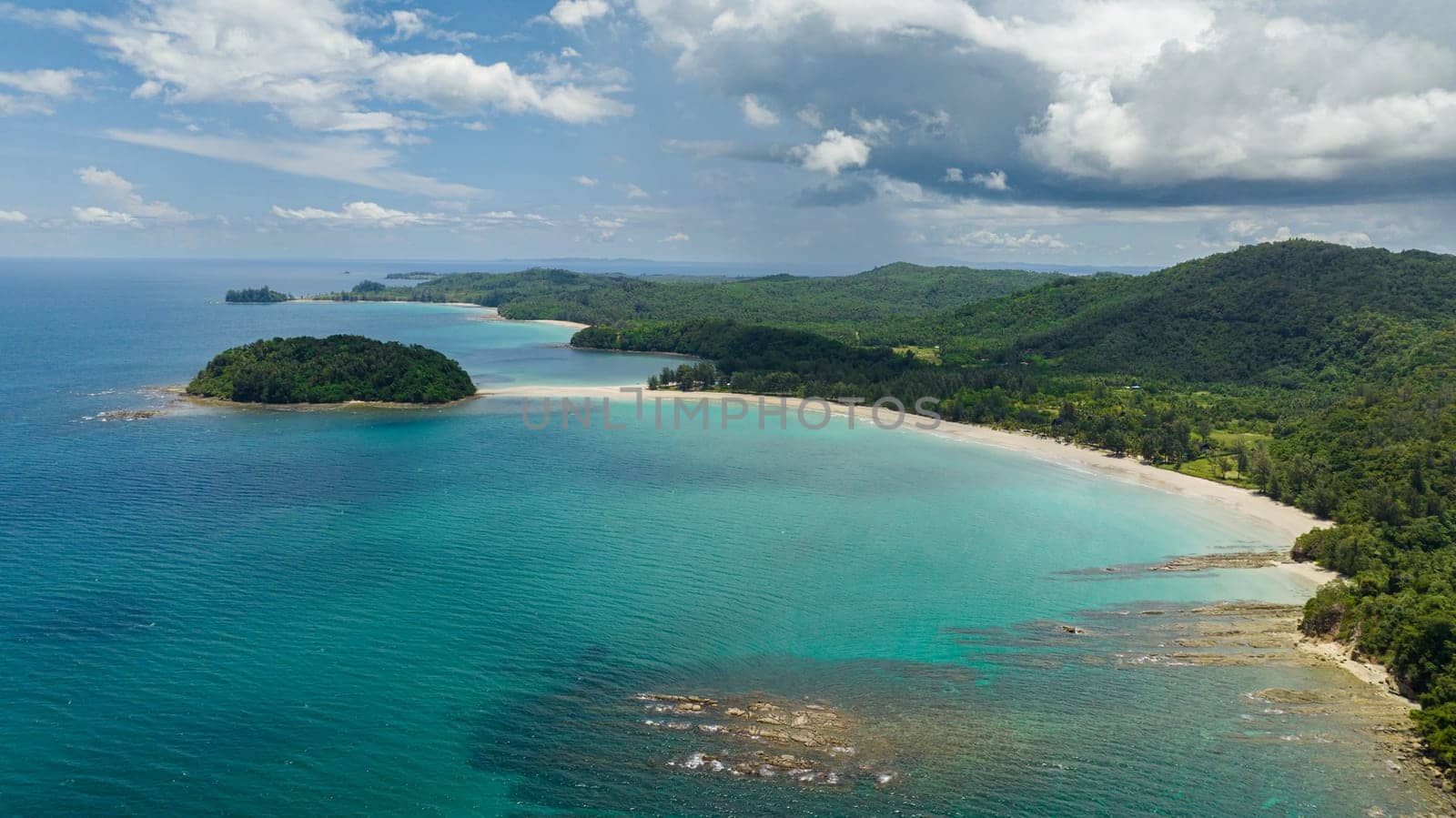 Aerial drone of tropical landscape with sandy beach and island. Kelambu Beach. Borneo, Malaysia.