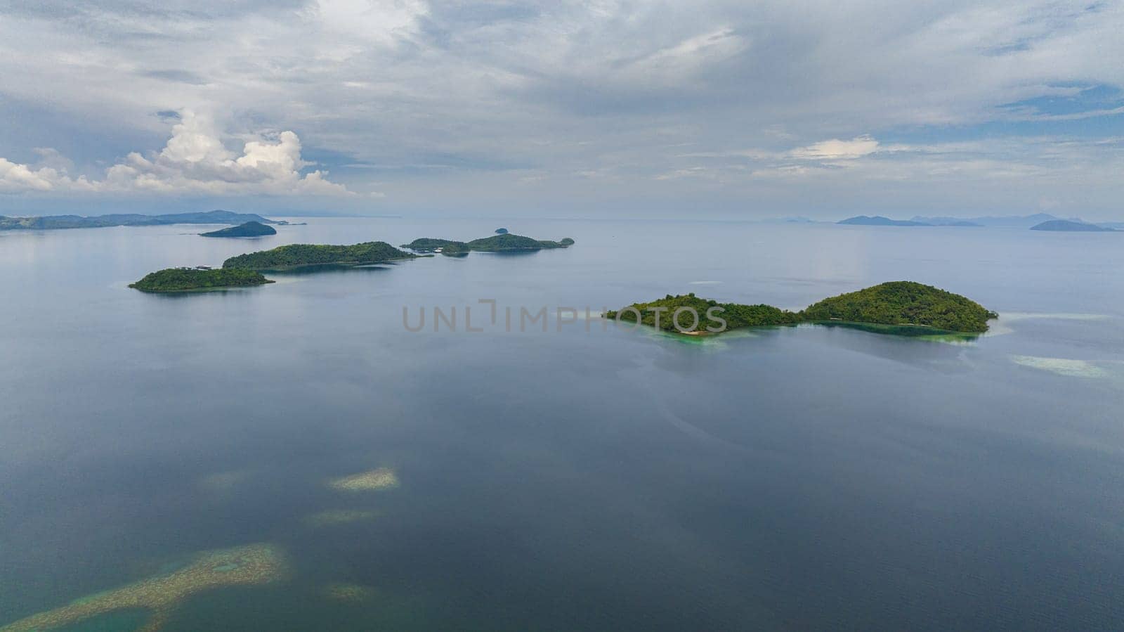 Aerial view of tropical islands with lagoons. Seascape in the tropics. Borneo, Sabah, Malaysia.