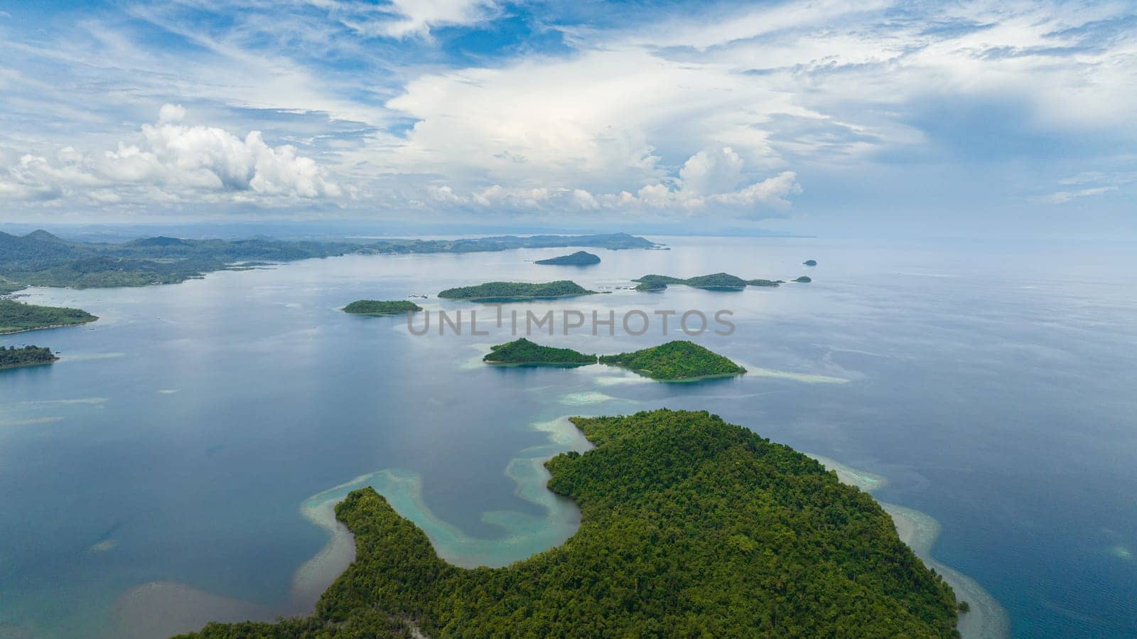 Aerial seascape with tropical islands and blue sea. Borneo, Sabah, Malaysia.