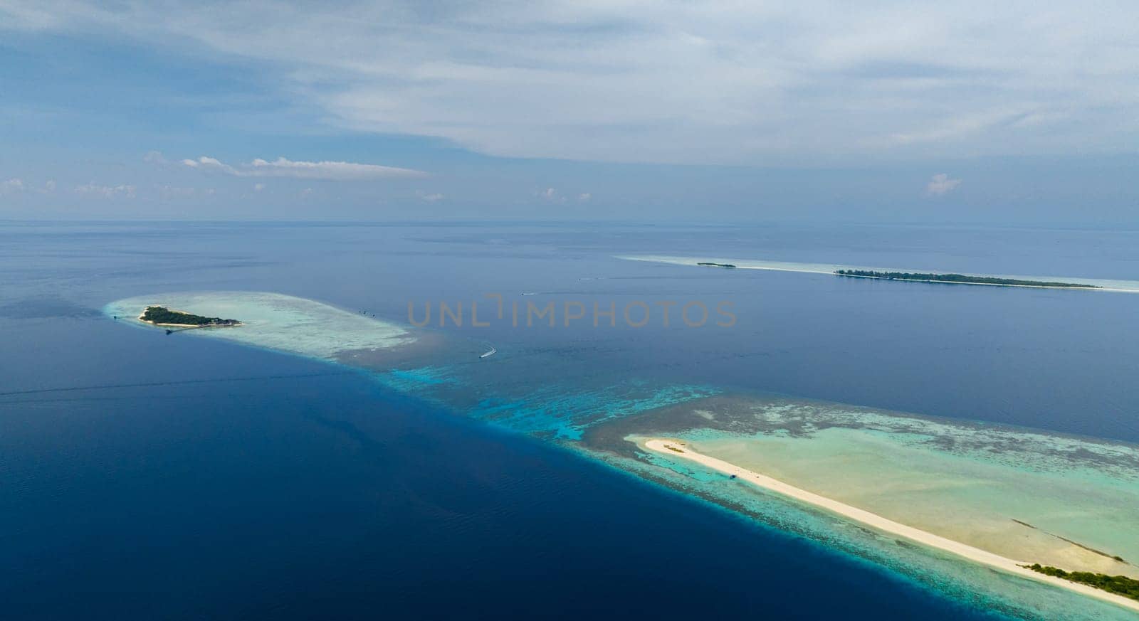 Top view of tropical islands on the atoll and coral reef. Timba Timba islet. Tun Sakaran Marine Park. Borneo, Sabah, Malaysia.