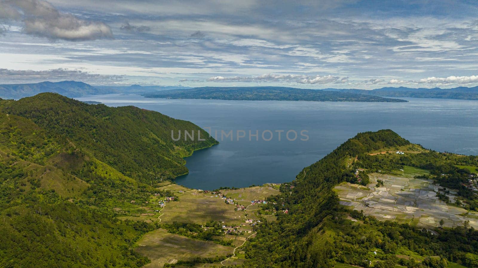 Aerial drone of lake Toba and farmland in the highlands. Sumatra, Indonesia.