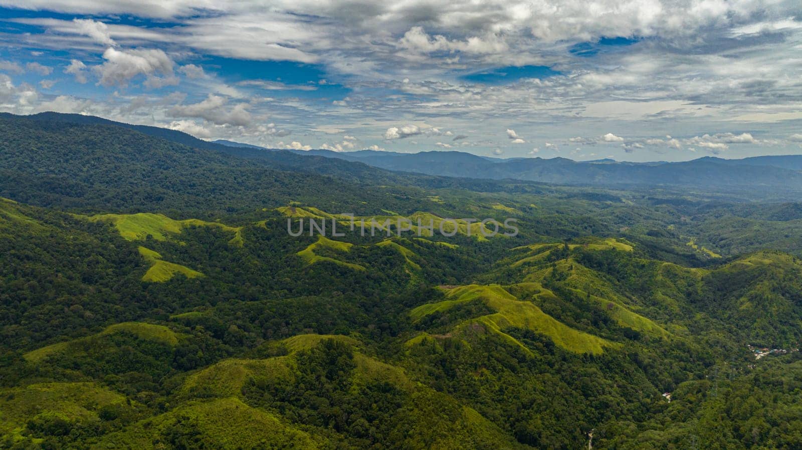 Mountain peaks covered with forest from above. Sumatra, Indonesia.