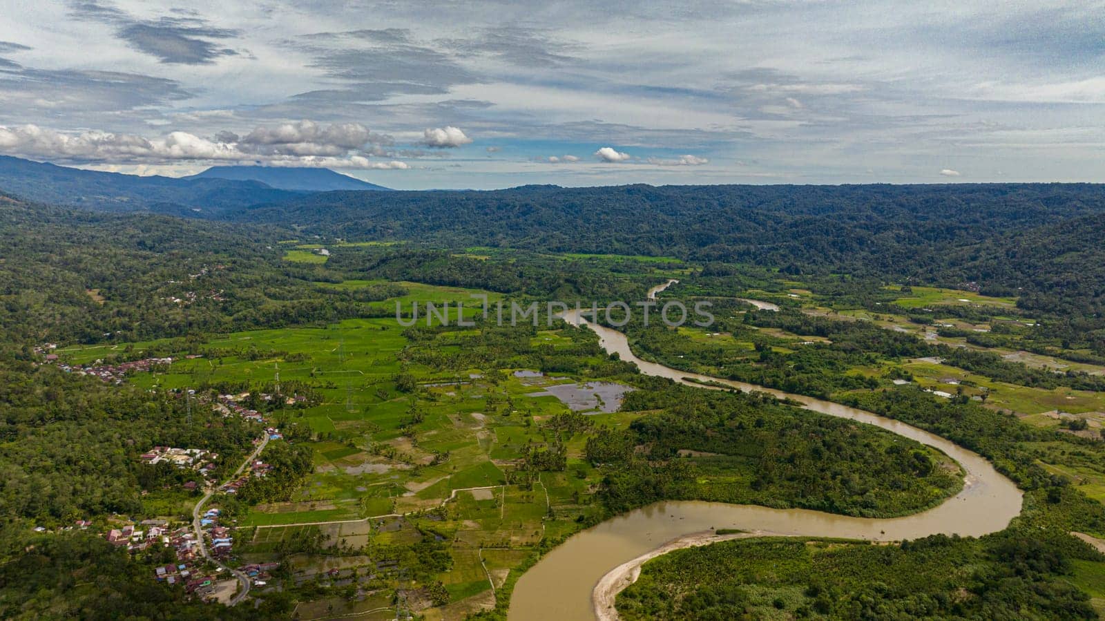 Valley with farmland and rice fields in the highlands. Sumatra, Indonesia.