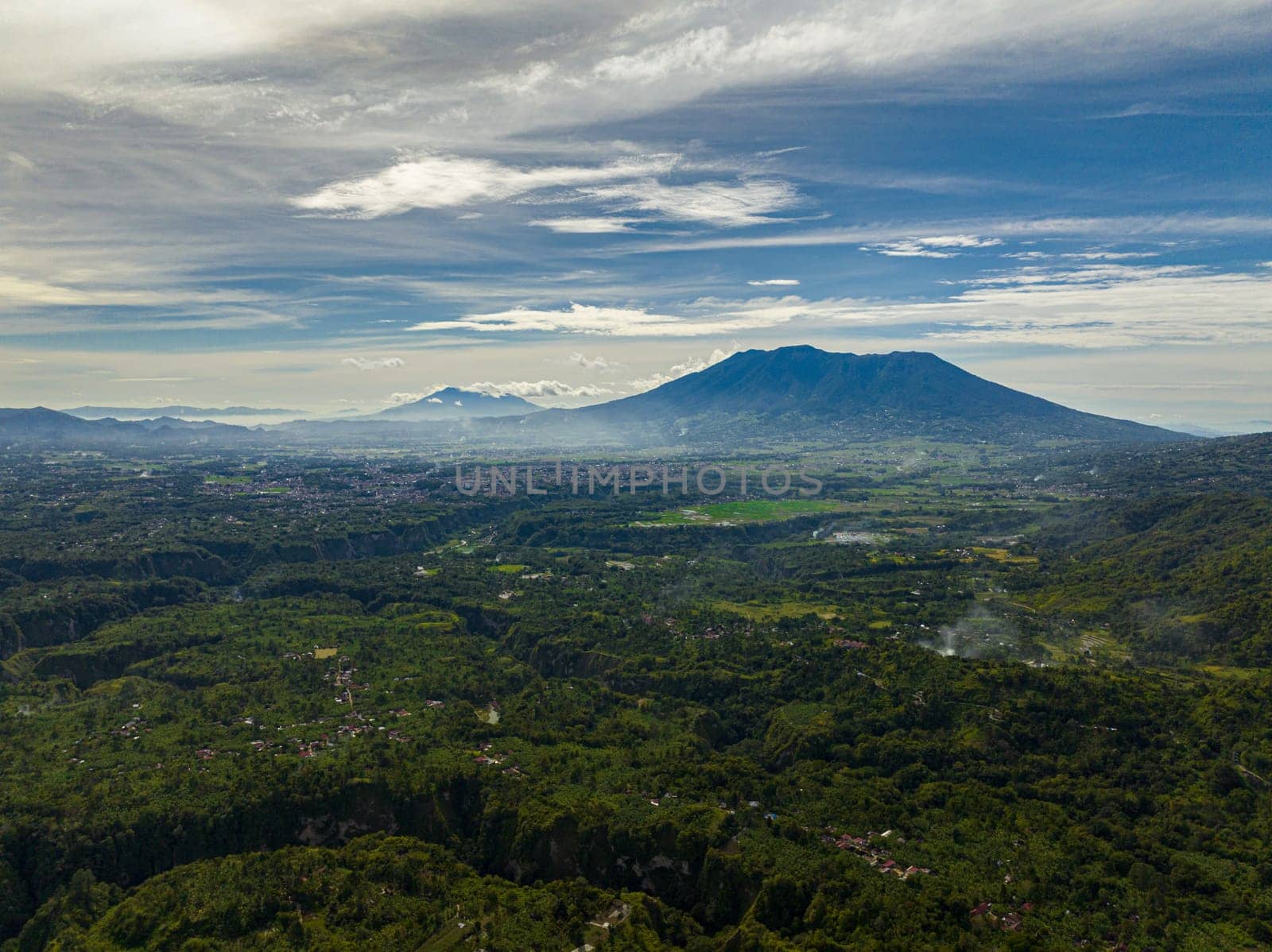 Top view of mountains and farmland in the tropics. Bukittinggi, Sumatra. Indonesia.