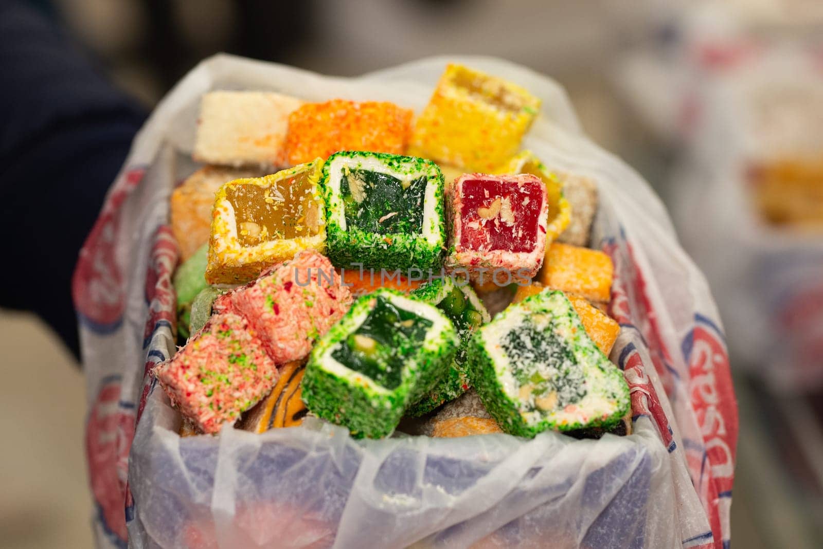 Traditional oriental sweets - Rahat Lukum. Fruit candy with fruit fillings. Different colors and different sprinkles. High quality photo